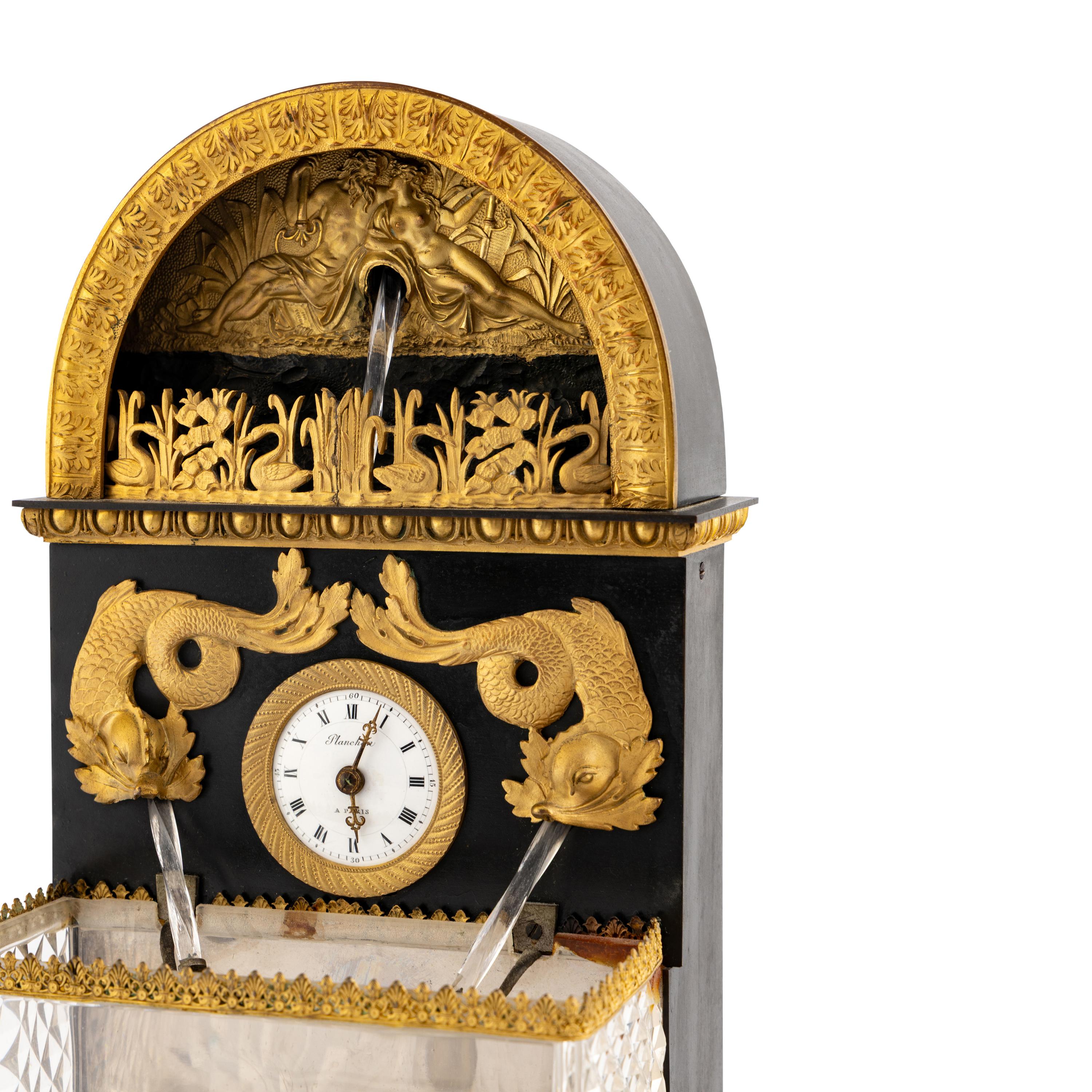 A French Patinated and Gilt Bronze and Cut Glass "Fountain" Mantel Clock