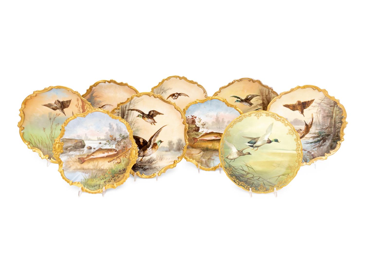 A Set of Eight Limoges Porcelain Fish and Game Plates