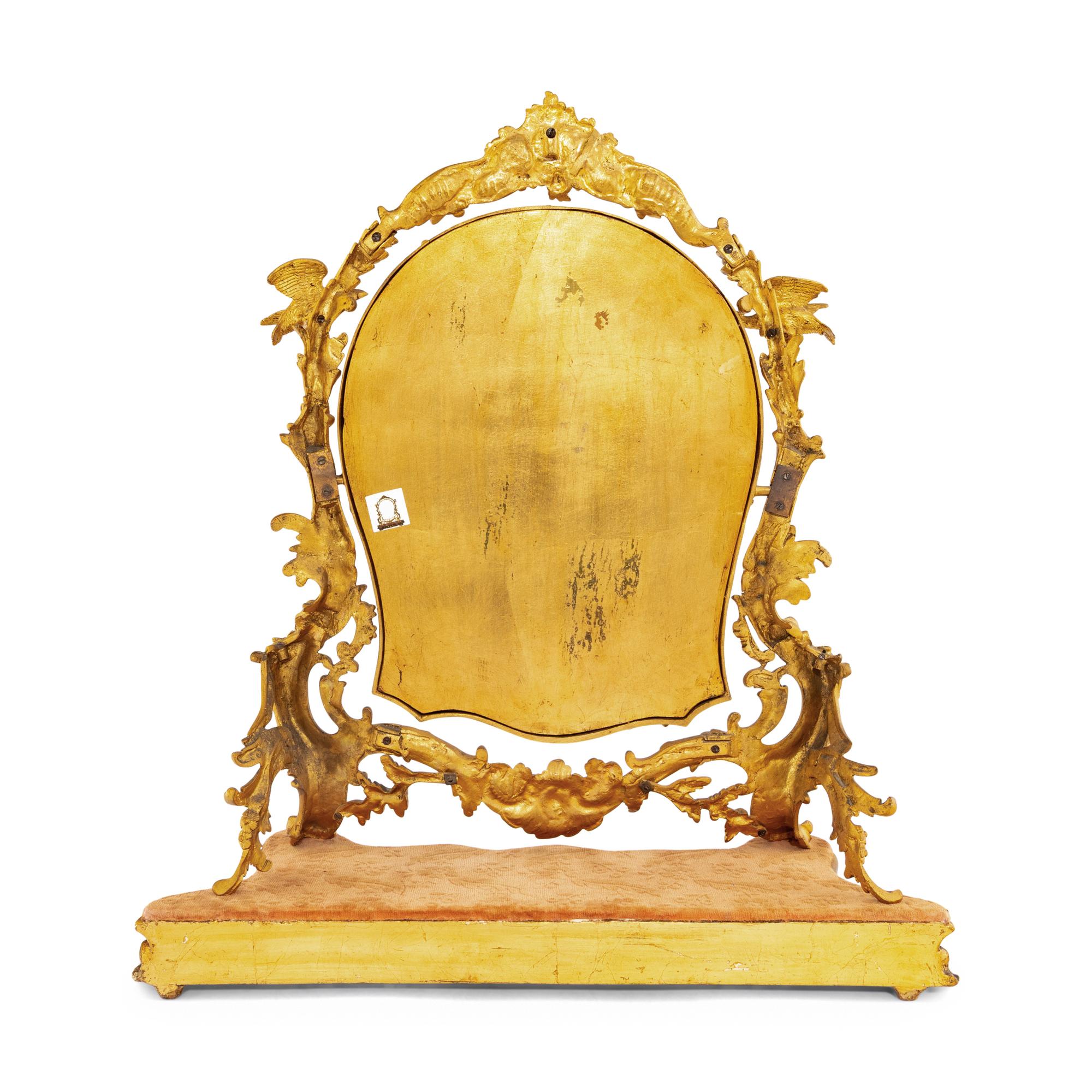A Rococo Revival Gilt Bronze and Giltwood Dressing Mirror