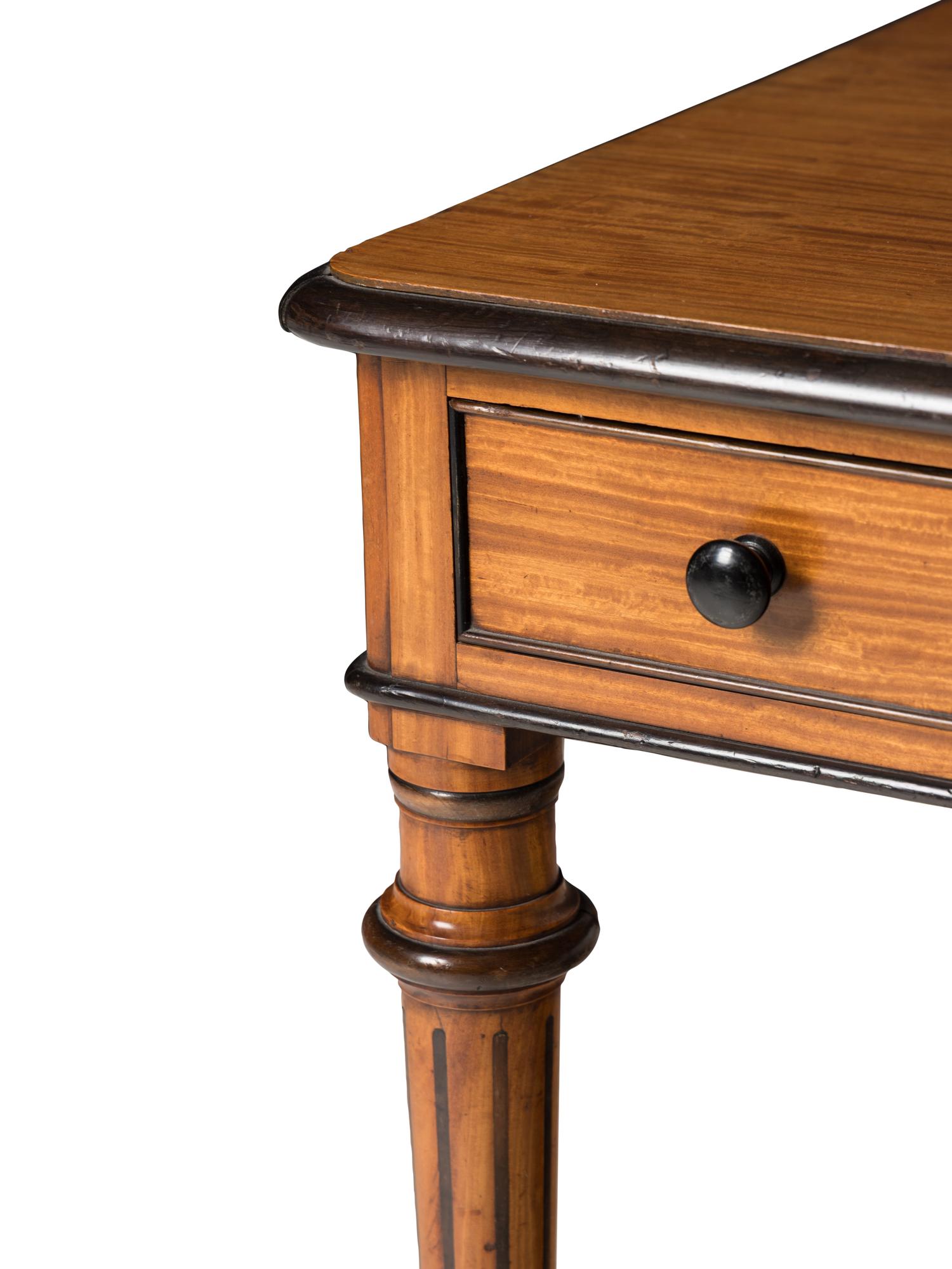 An English Satinwood and Parcel-Ebonized Dressing Table