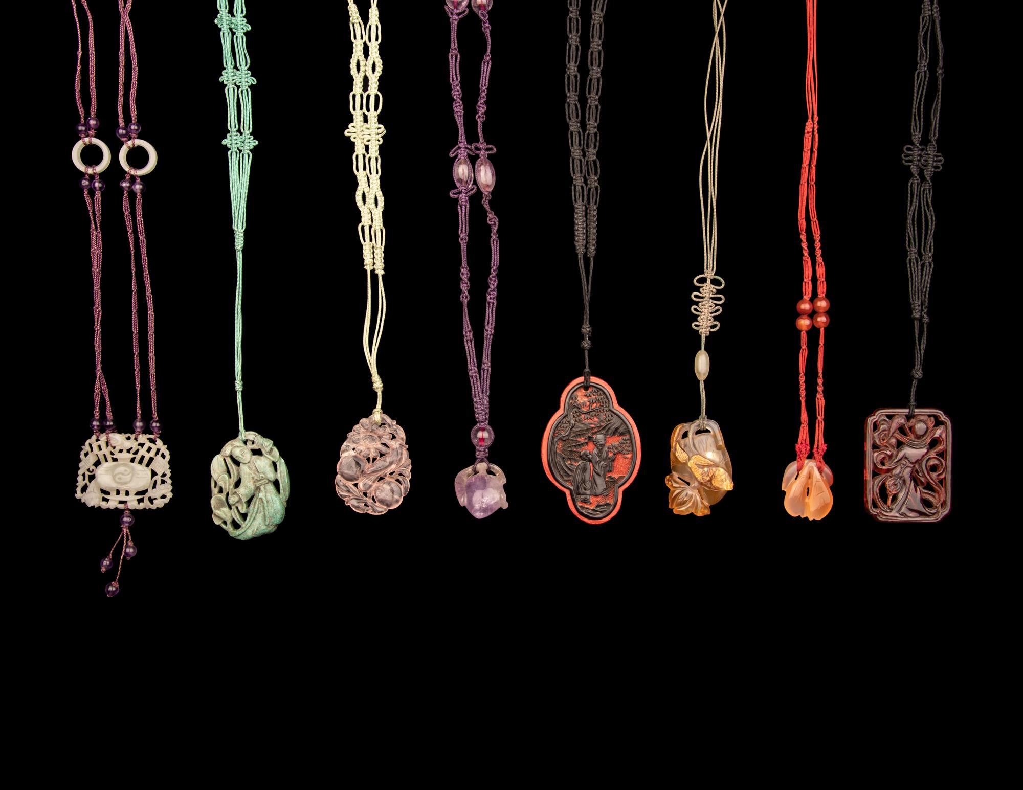 Eight Chinese Hardstone and Lacquer Pendants