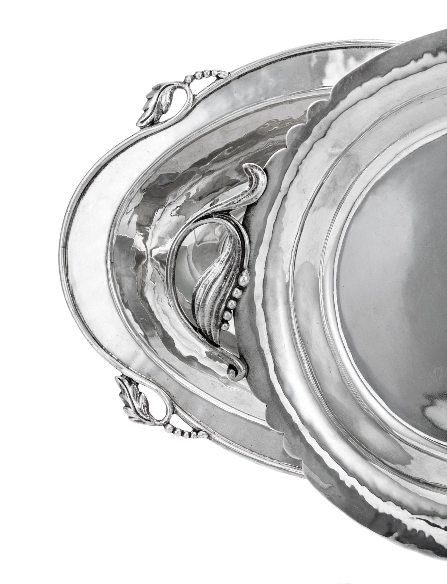 Two American Silver Dishes, Cellini Craft, Ltd., Chicago, IL, each having stylized leaf handles.