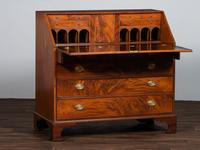 A Chippendale Figured Mahogany Slant-Front Desk