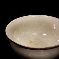 A Chinese Ding -Style Incised White Glazed Porcelain Bowl, Possibly Song Dynasty 或為宋 定窯白釉劃花鳳穿牡丹紋碗