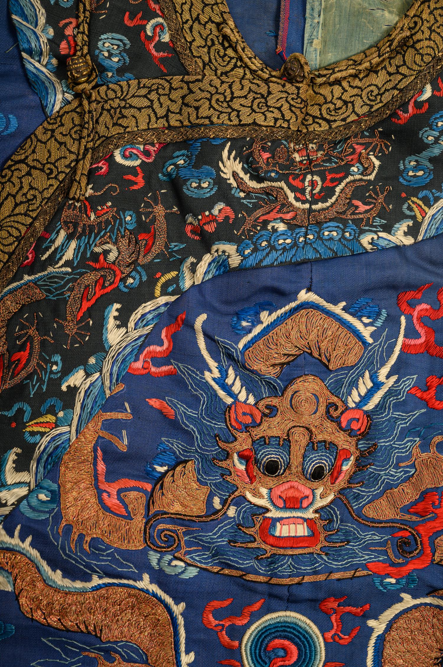 A Blue Ground Embroidered Silk Dragon Robe, Jifu