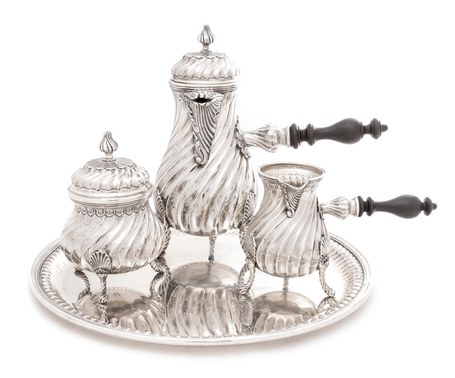 An Italian Silver Coffee Service, Buccellati, 20th Century, comprising a coffee pot, a covered sugar, a creamer, and a tray, the servin