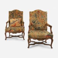 A Pair of French Régence Carved Walnut Bergères 18th century