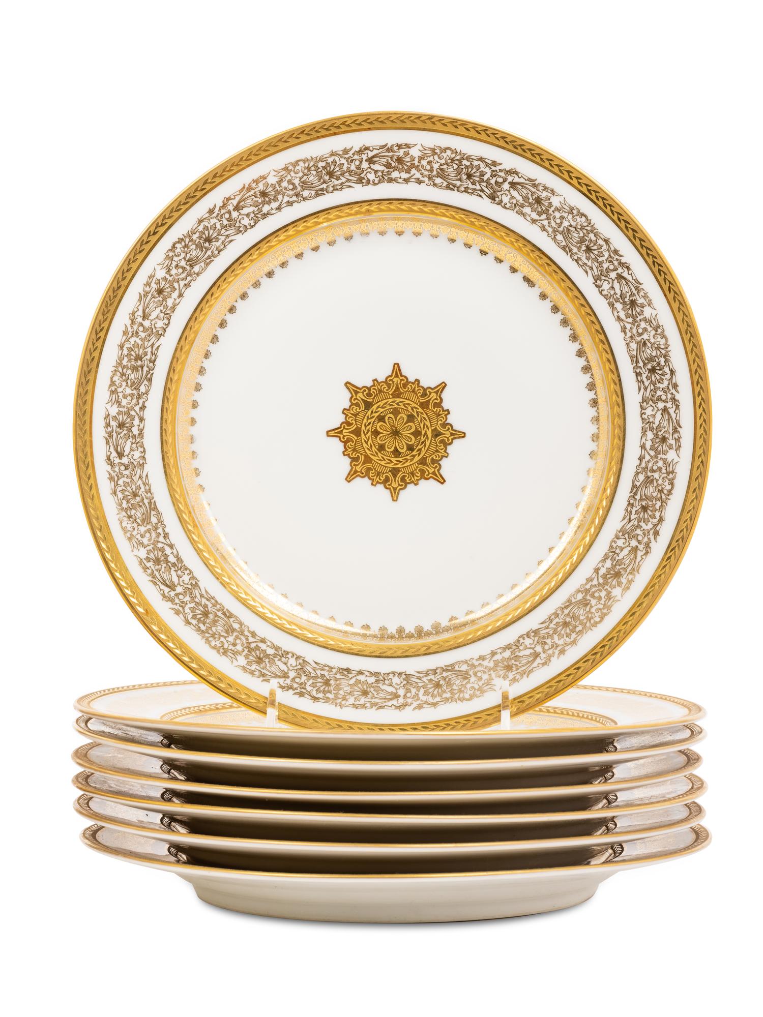 Two Sets of Gilt Porcelain Dinner Plates