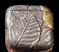 A Chinese Parcel-Gilt Silver Repoussé 'Plantain Leaves' Rectangular Scroll Box, Incised Qianlong Mark 清乾隆乙卯（1796）銀鎏金鏨蕉葉紋手卷機關盒
