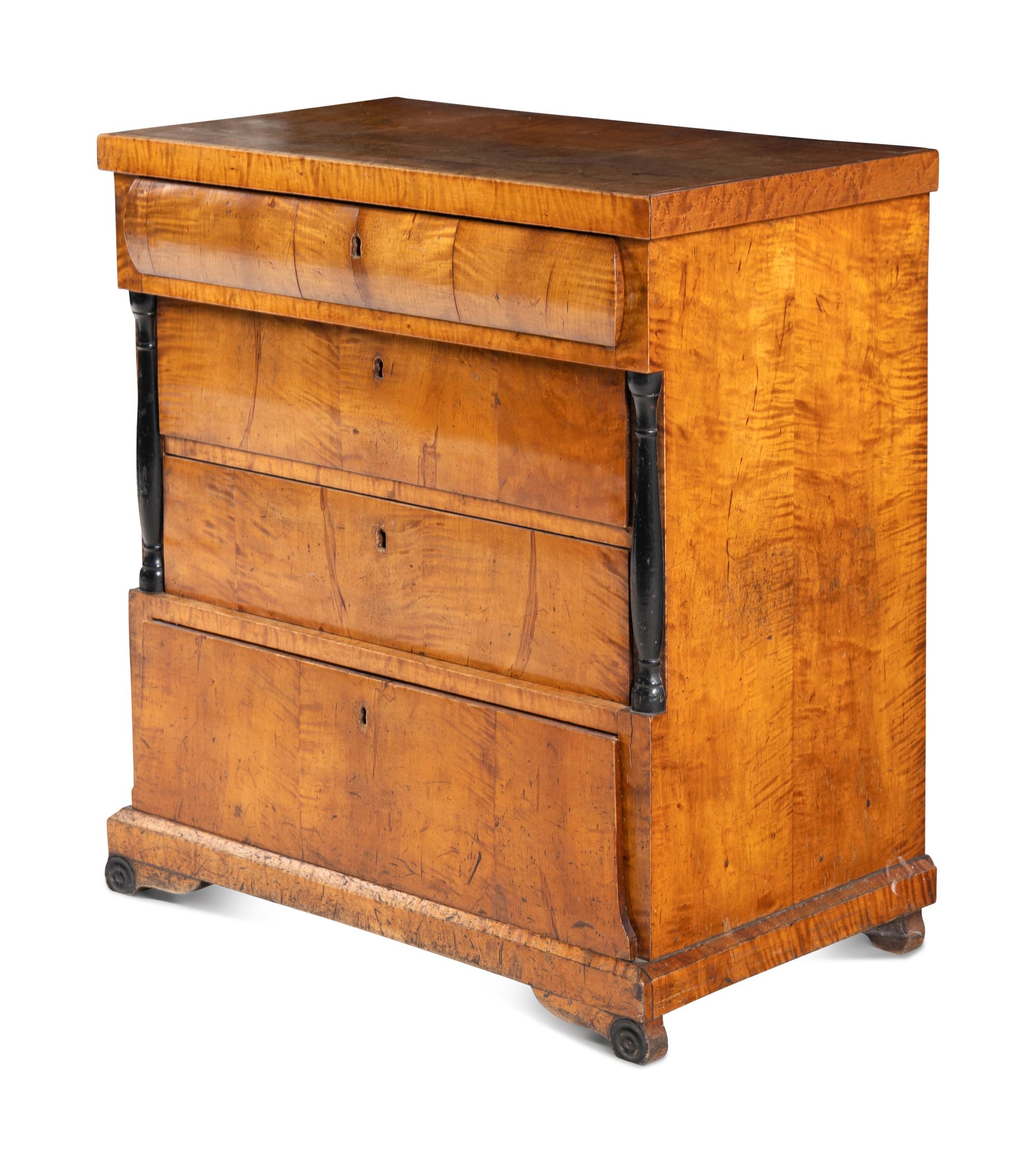A Biedermeier Maple Chest of Drawers