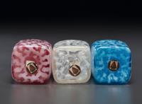 Three Coral Opalescent Glass Barber's Bottles