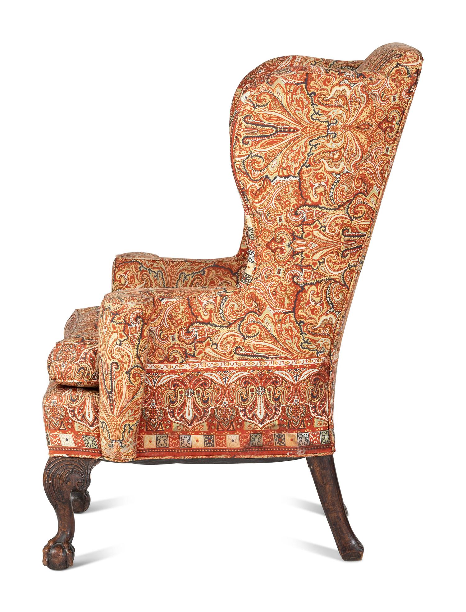 A George III Carved Walnut Claw-and-Ball Foot Easy Chair