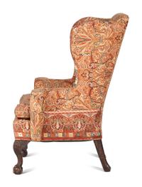 A George III Carved Walnut Claw-and-Ball Foot Easy Chair