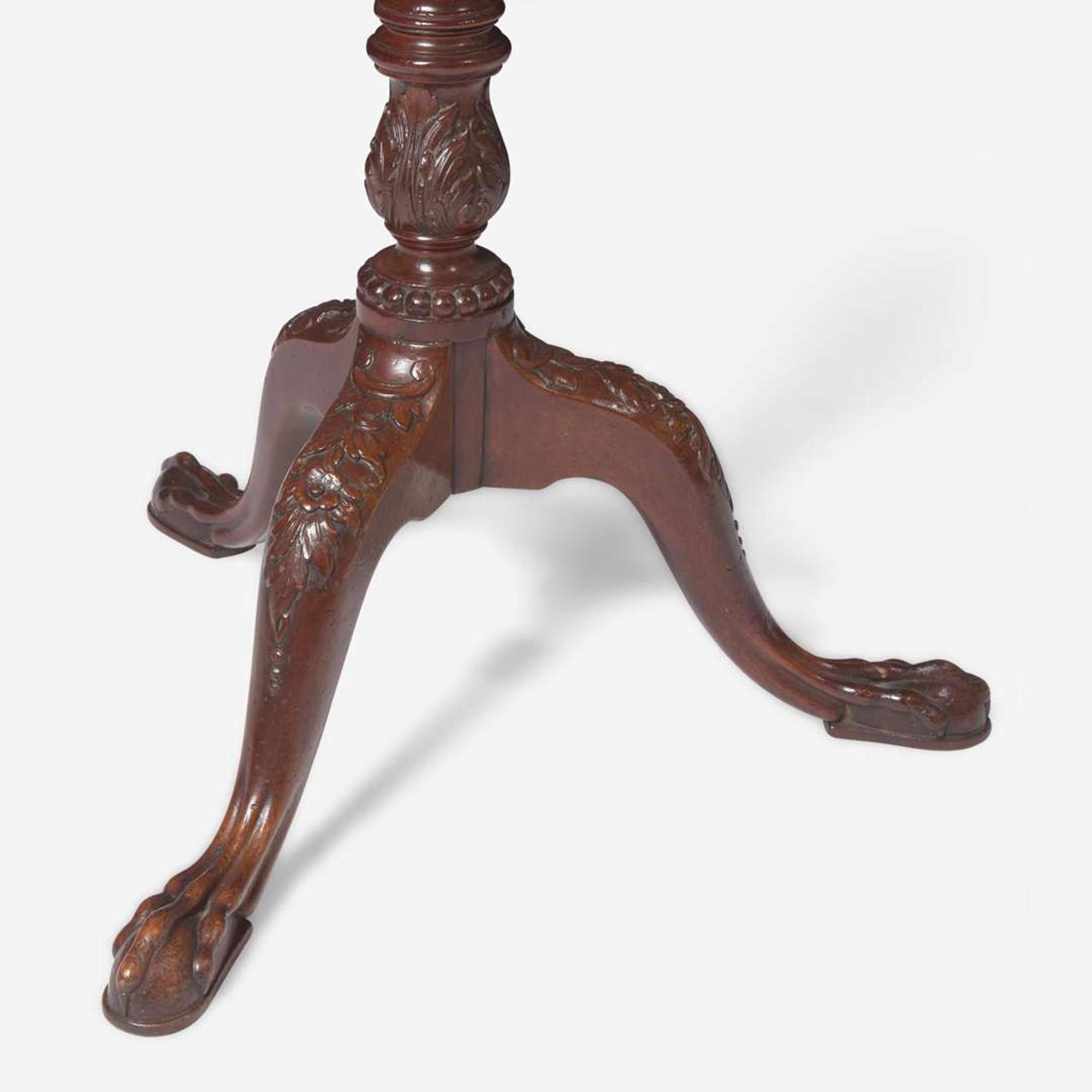 A George III carved mahogany tilt-top candlestand circa 1760