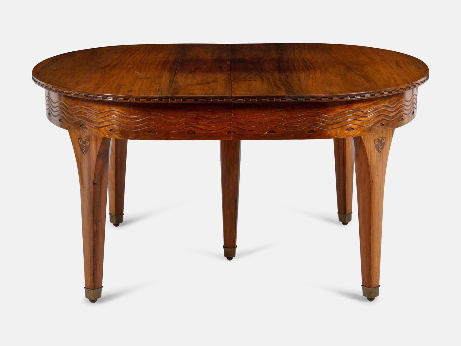 An Austrian Secessionist Inlaid Dining Suite, comprising a sideboard, a server, an extension dining table with five leaves, six side chairs and four armchairs