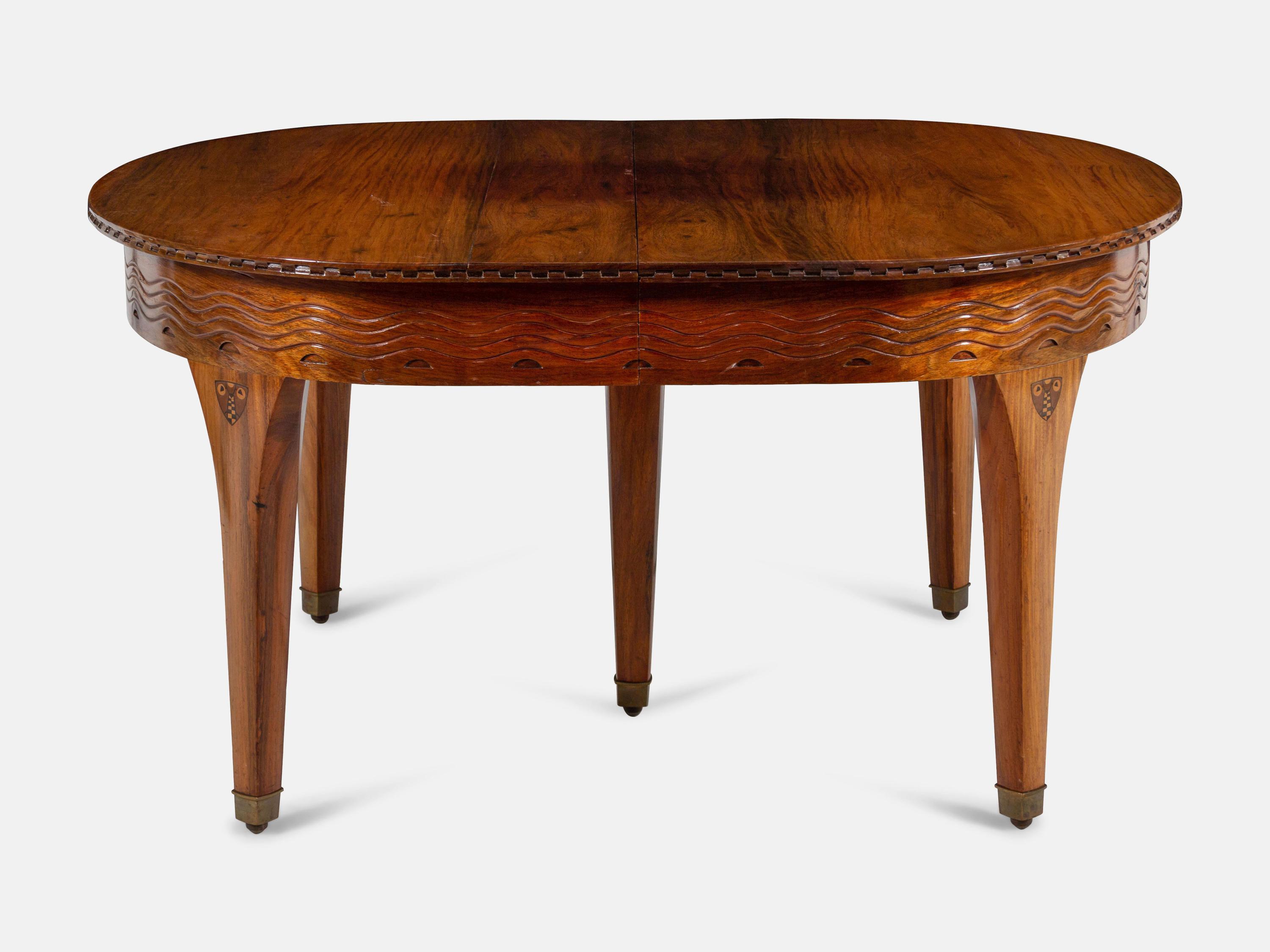 An Austrian Secessionist Inlaid Dining Suite, comprising a sideboard, a server, an extension dining table with five leaves, six side chairs and four armchairs