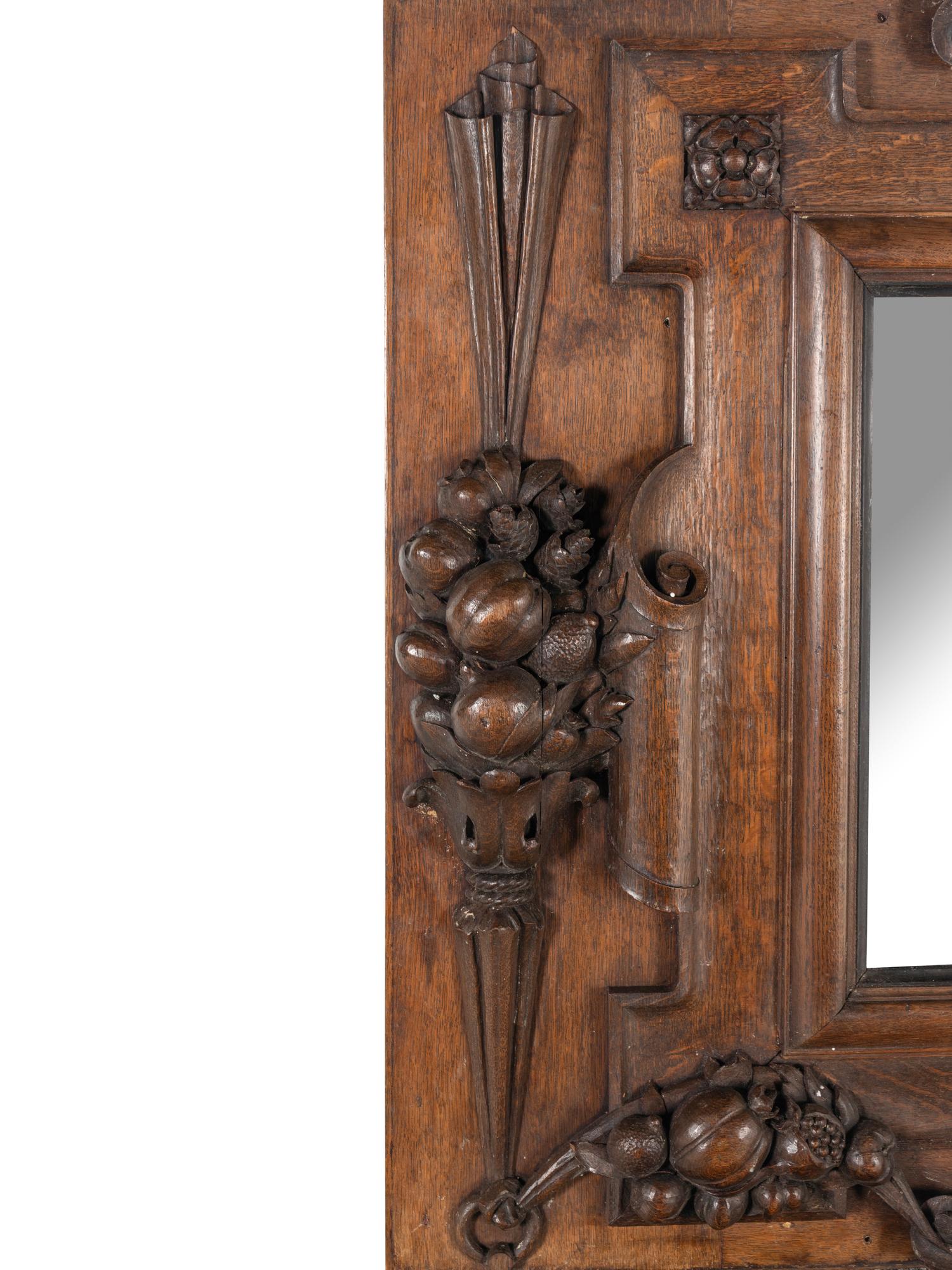 A Continental Carved Oak Mirror