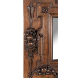 A Continental Carved Oak Mirror