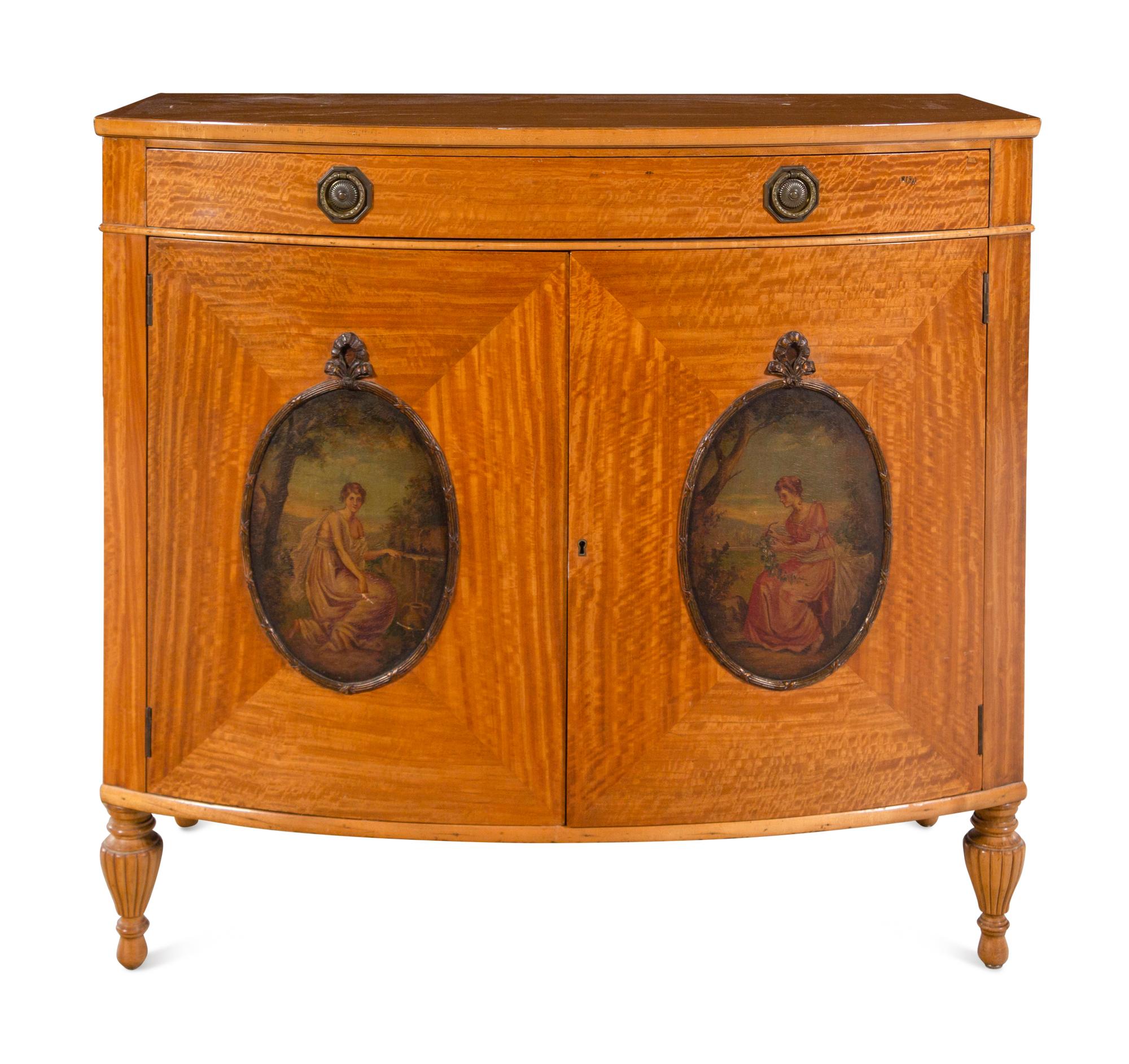 An Edwardian Painted Satinwood Bowfront Cabinet