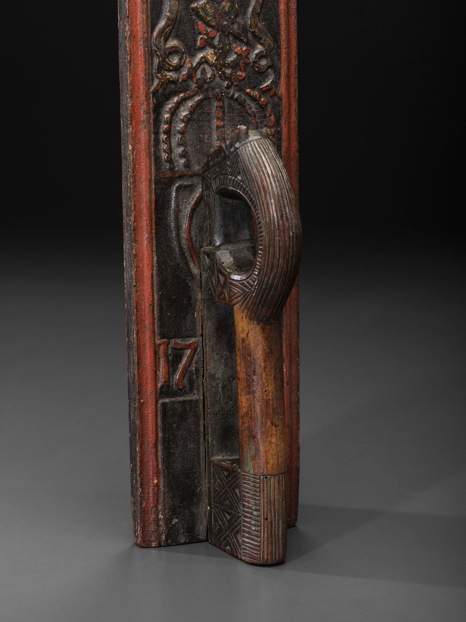 A Scandinavian Carved and Painted Maple Mangle Board