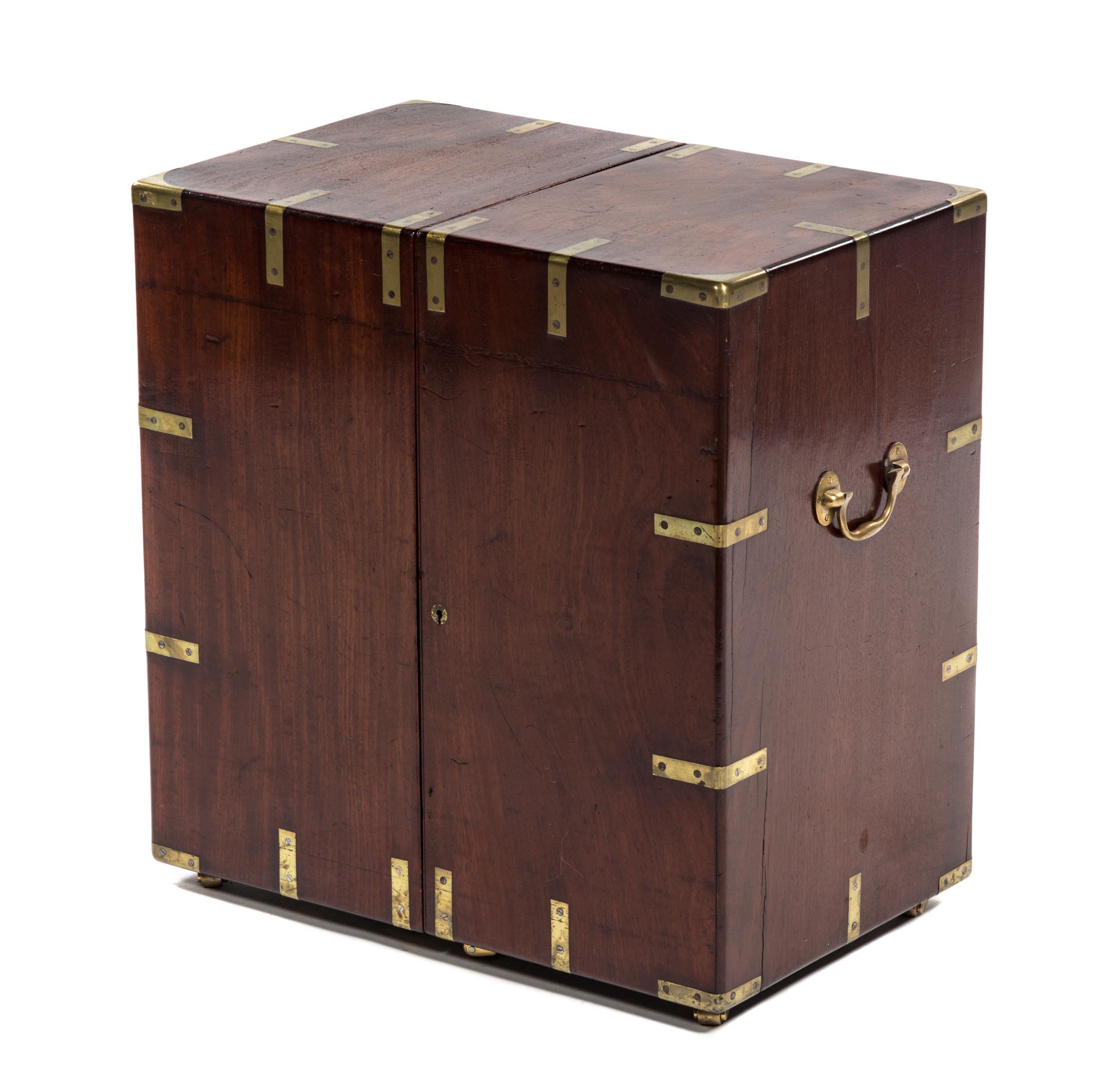 An English Brass Mounted Walnut Campaign Bookcase, 19TH CENTURY, Height 24 x width 15 x depth 23 inches (closed). — 19TH CENTURY,