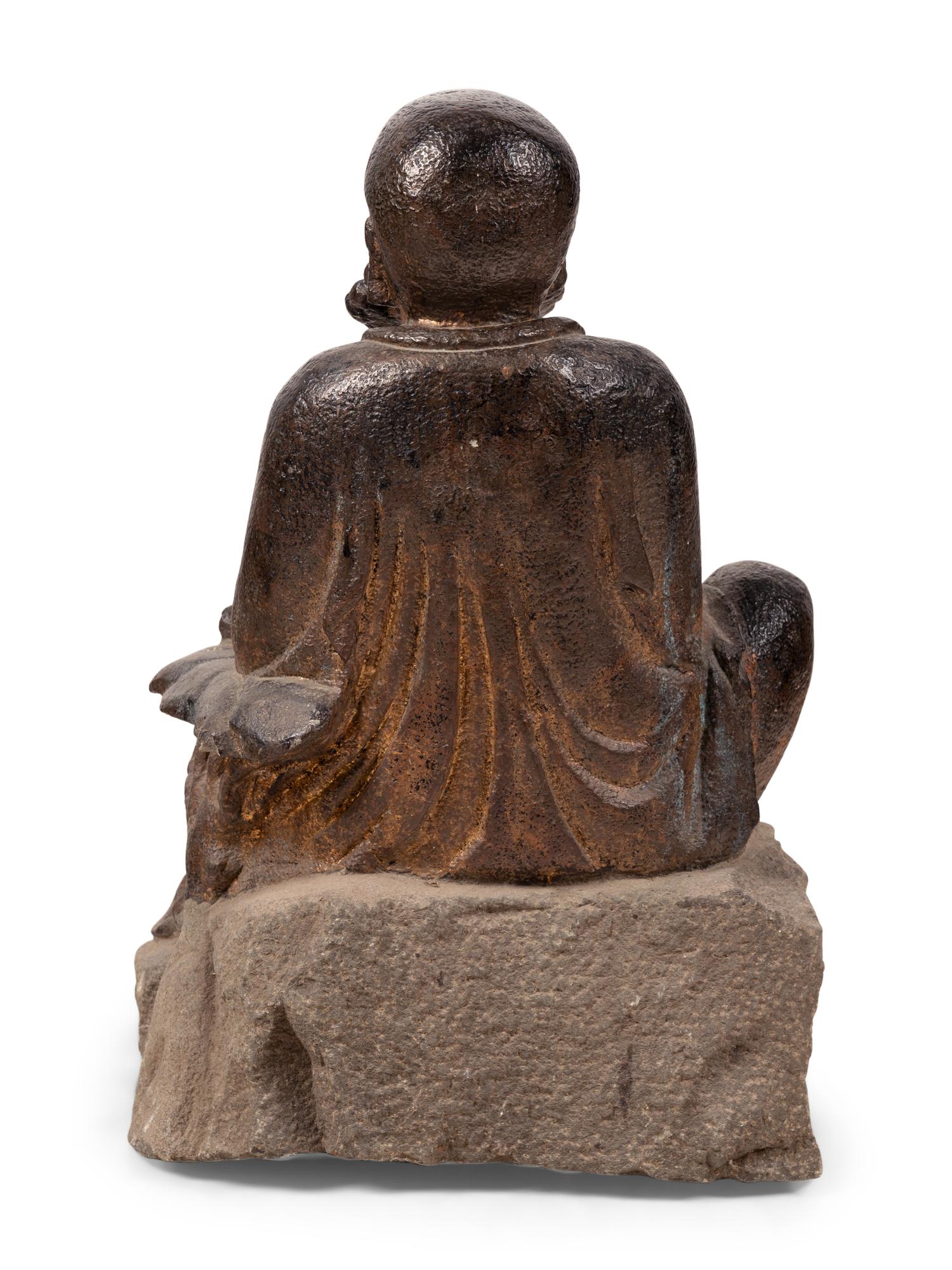 A Chinese Carved Stone Seated Figure