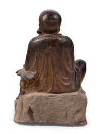 A Chinese Carved Stone Seated Figure