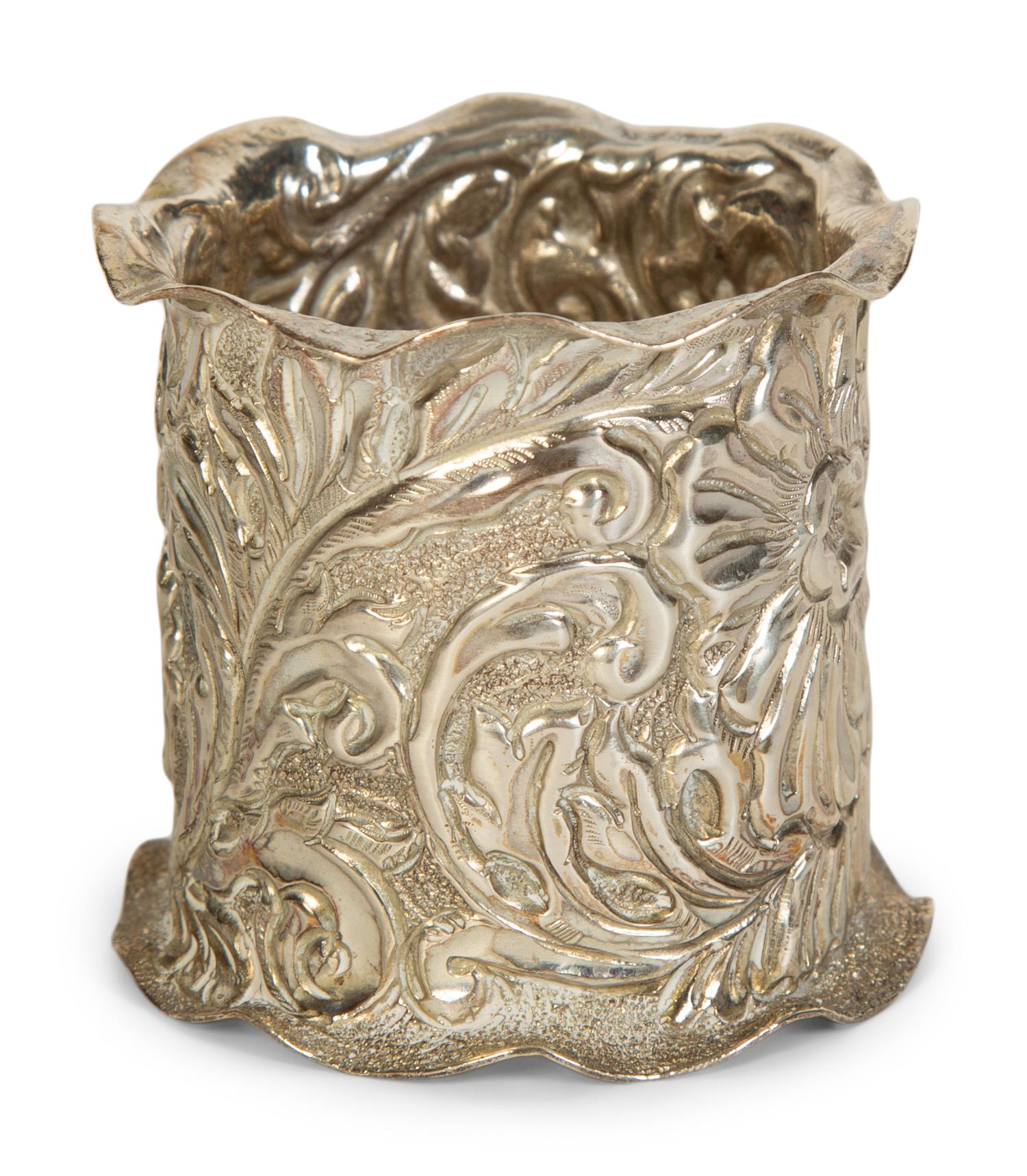 Twelve American Repoussé Silver Napkin Rings