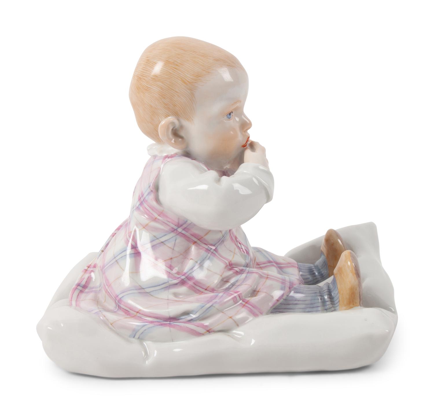 A Meissen Porcelain Figure of a Baby Feeding ,by Konrad Hentschel