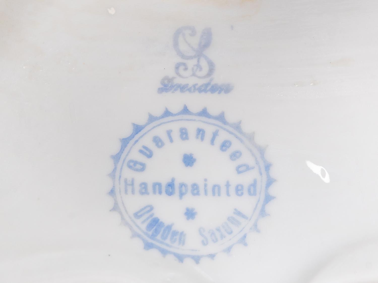 A Pair of Dresden Porcelain Candelabra