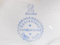 A Pair of Dresden Porcelain Candelabra