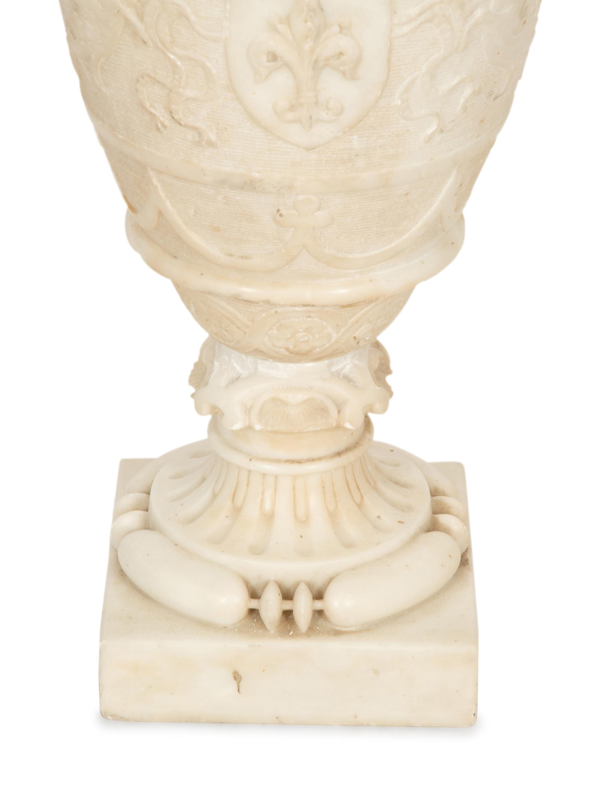 An Italian Carved Marble Urn with Griffin Handles