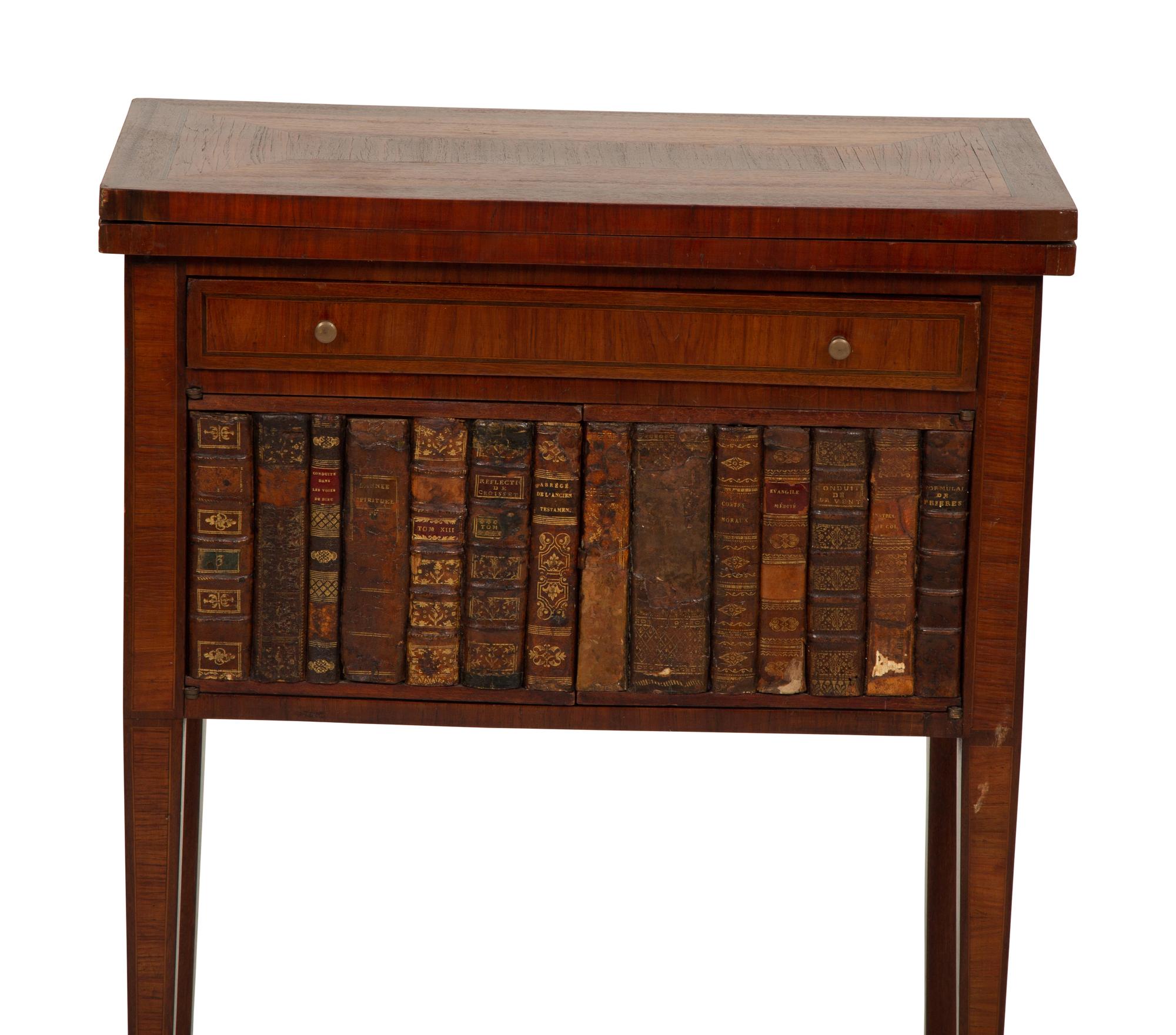 A Directoire Style Mahogany and Rosewood Small Cabinet with Faux-Leather Book Doors