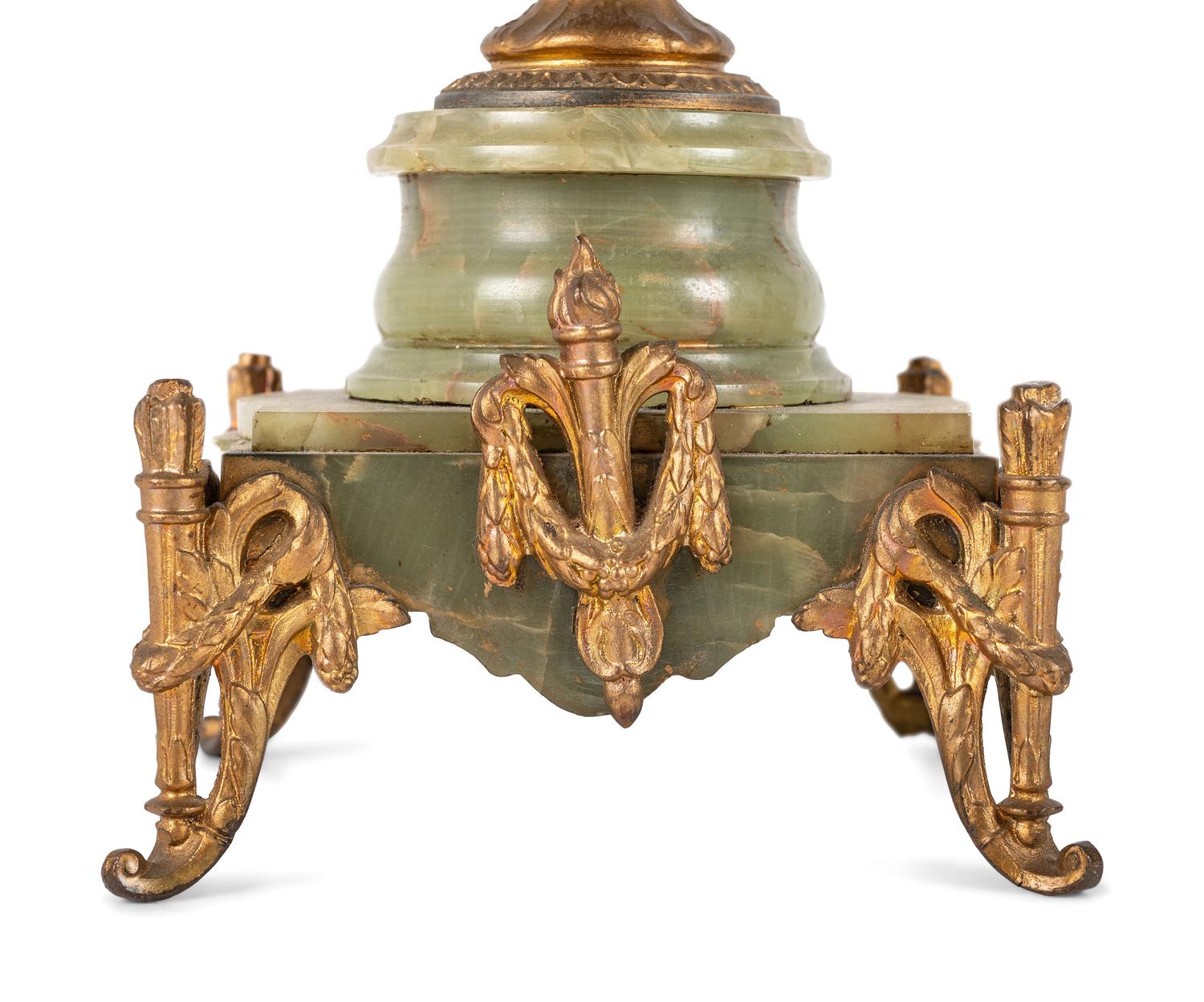 A Neoclassical Gilt Metal and Onyx Clock Garniture