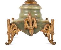 A Neoclassical Gilt Metal and Onyx Clock Garniture