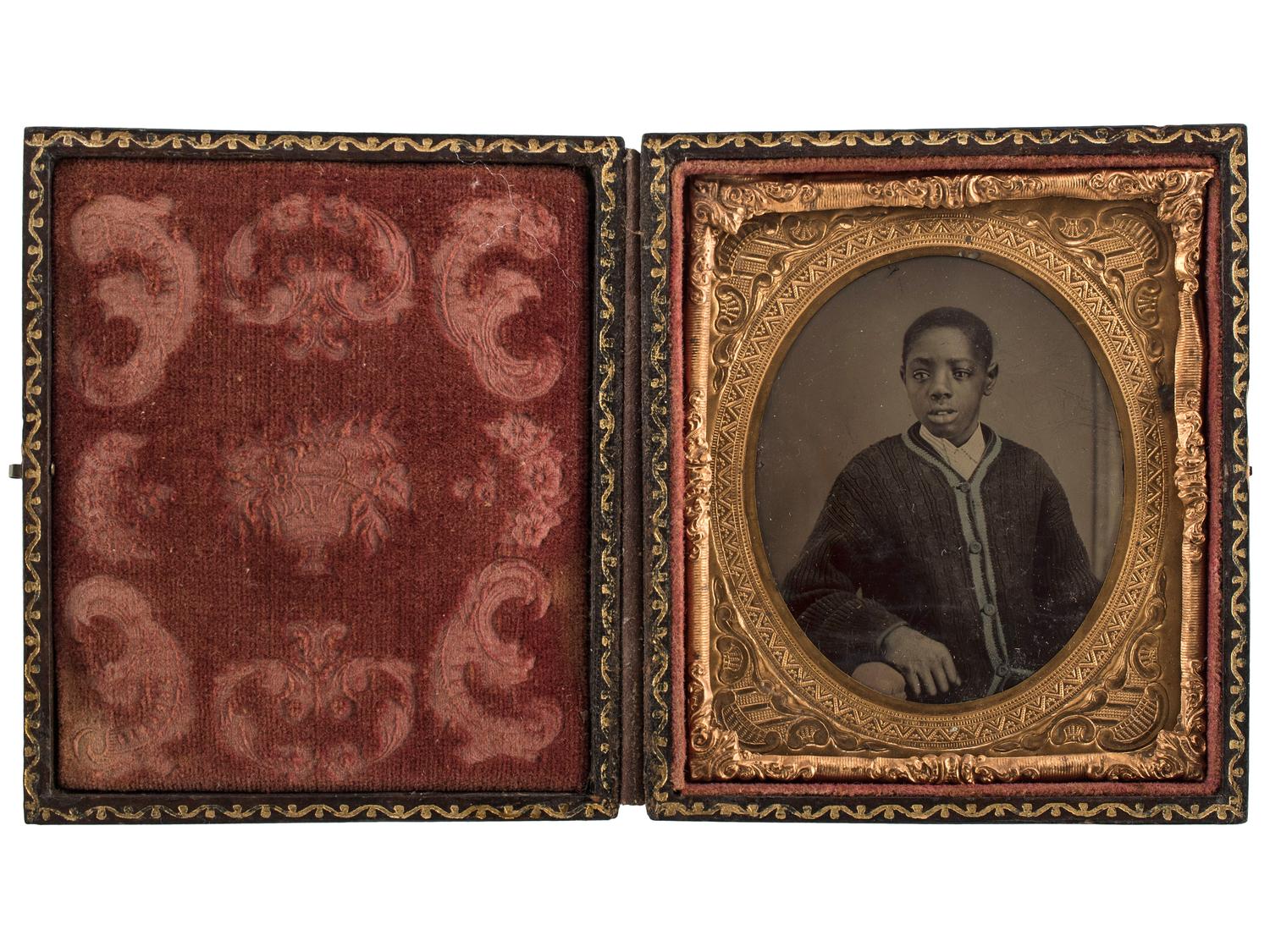 [EARLY PHOTOGRAPHY]. A group of 2 tintypes of African Americans, incl. female and male subjects.