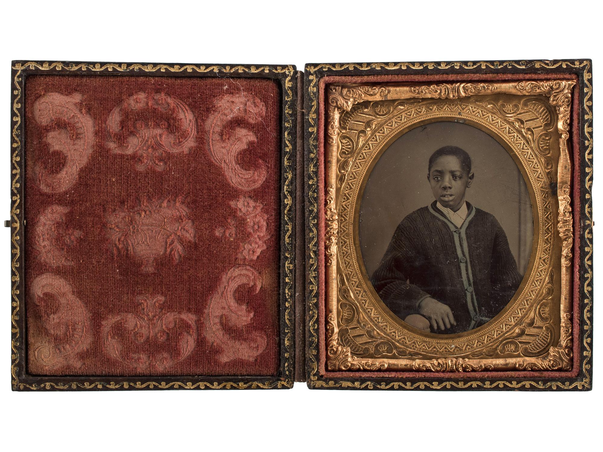 [EARLY PHOTOGRAPHY]. A group of 2 tintypes of African Americans, incl. female and male subjects.