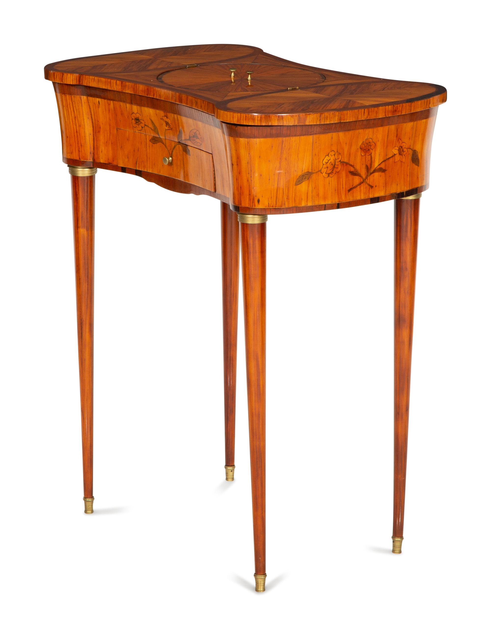 A Louis XVI Tulipwood and Marquetry Gilt Bronze-Mounted Sewing Table