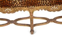 A Louis XV Style Giltwood Bench with Faux Leopard Upholstery