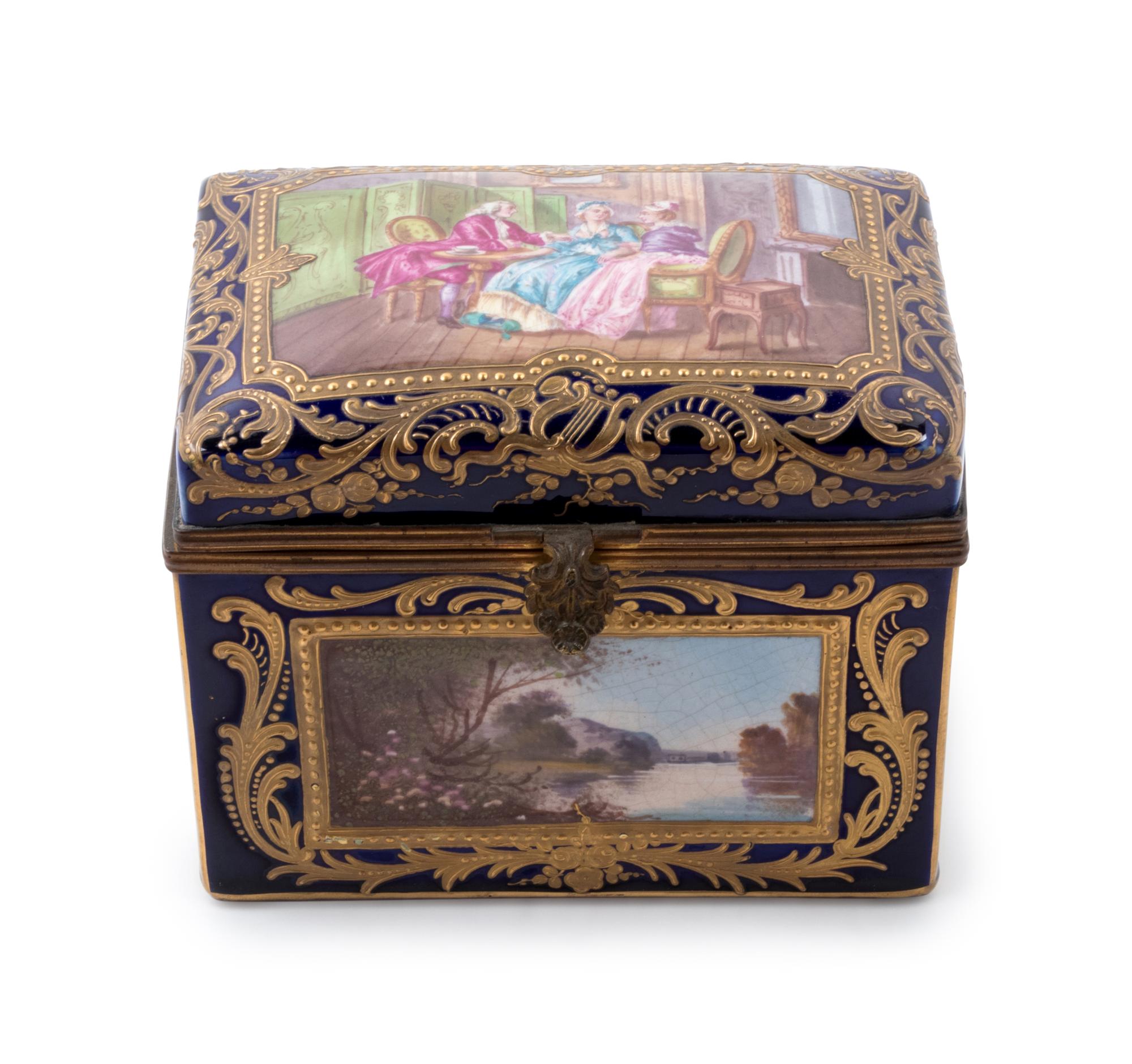 A Sèvres Style Painted and Parcel Gilt Porcelain Table Casket