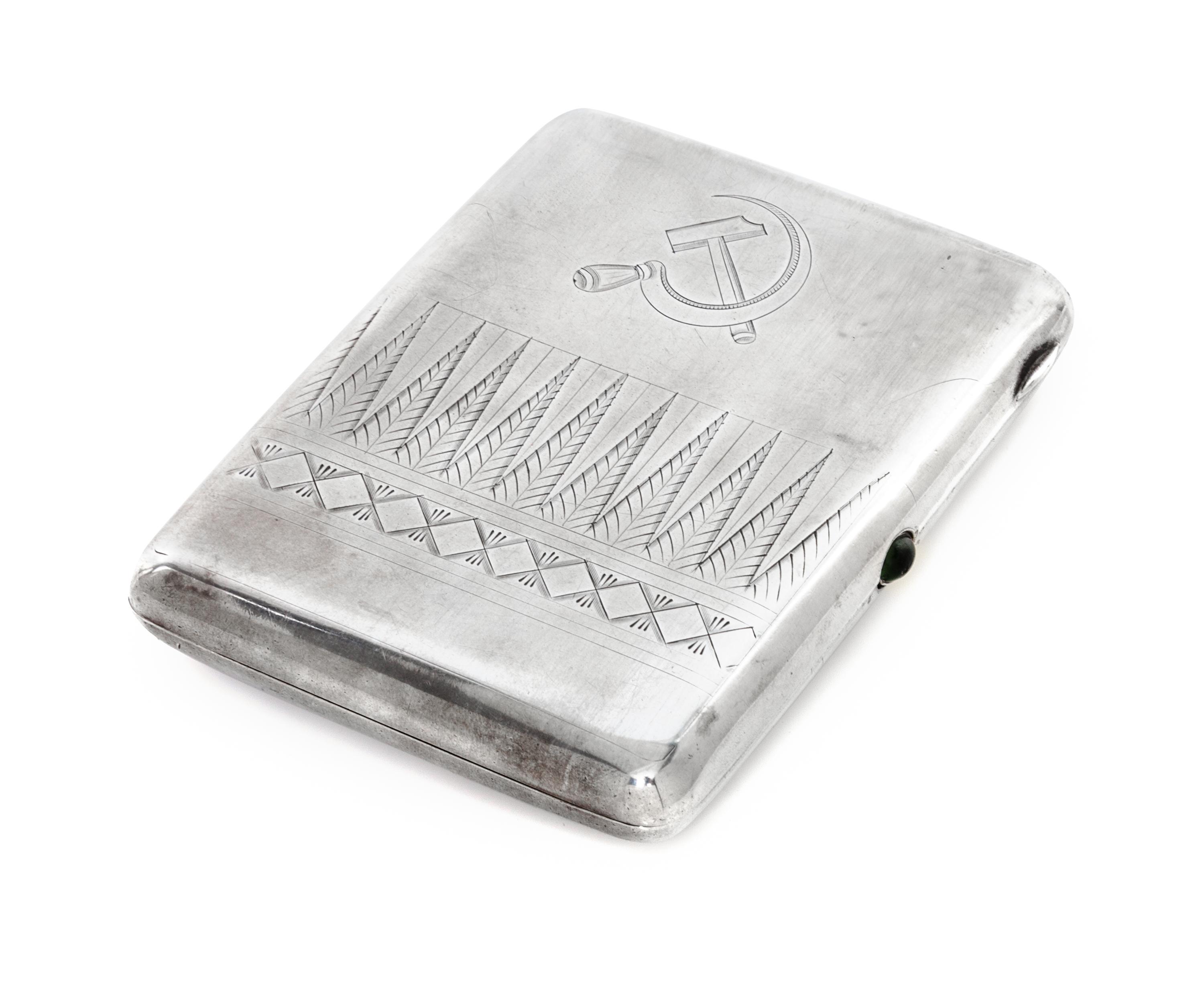 A Russian Silver Cigarette Case, Soviet Artel mark OKhA, Moscow, early 20th century, the lid engraved with a Soviet hammer and sickle a