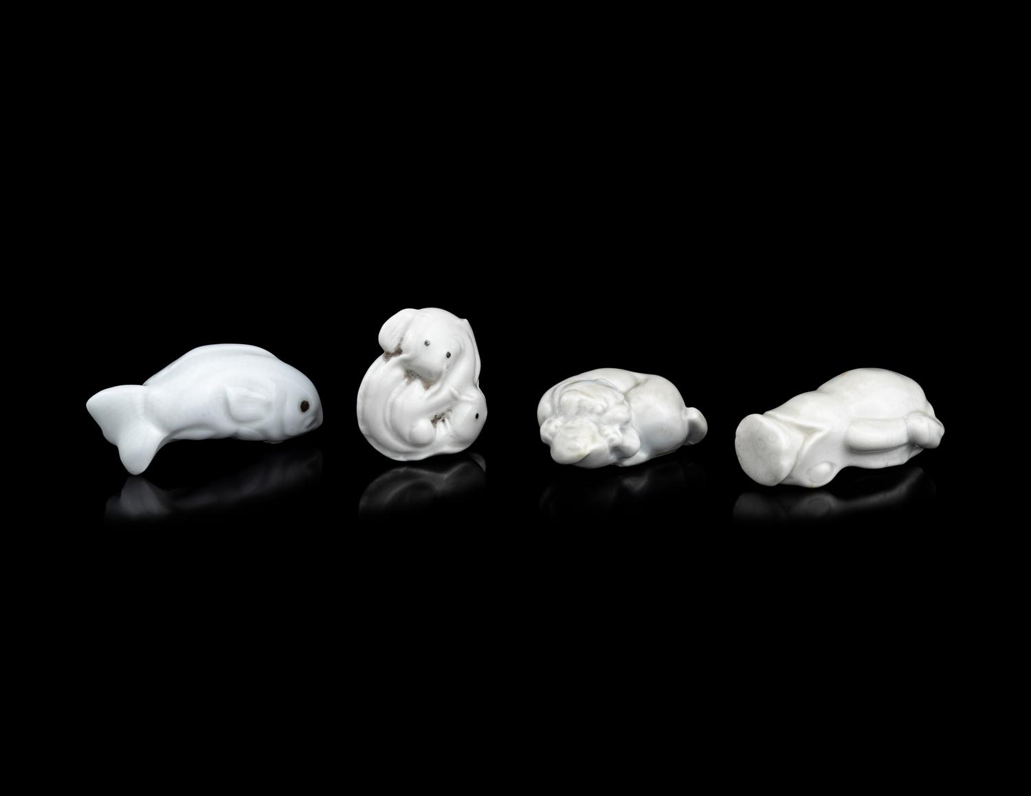 Four Japanese White Glazed Porcelain Animal-Form Netsuke