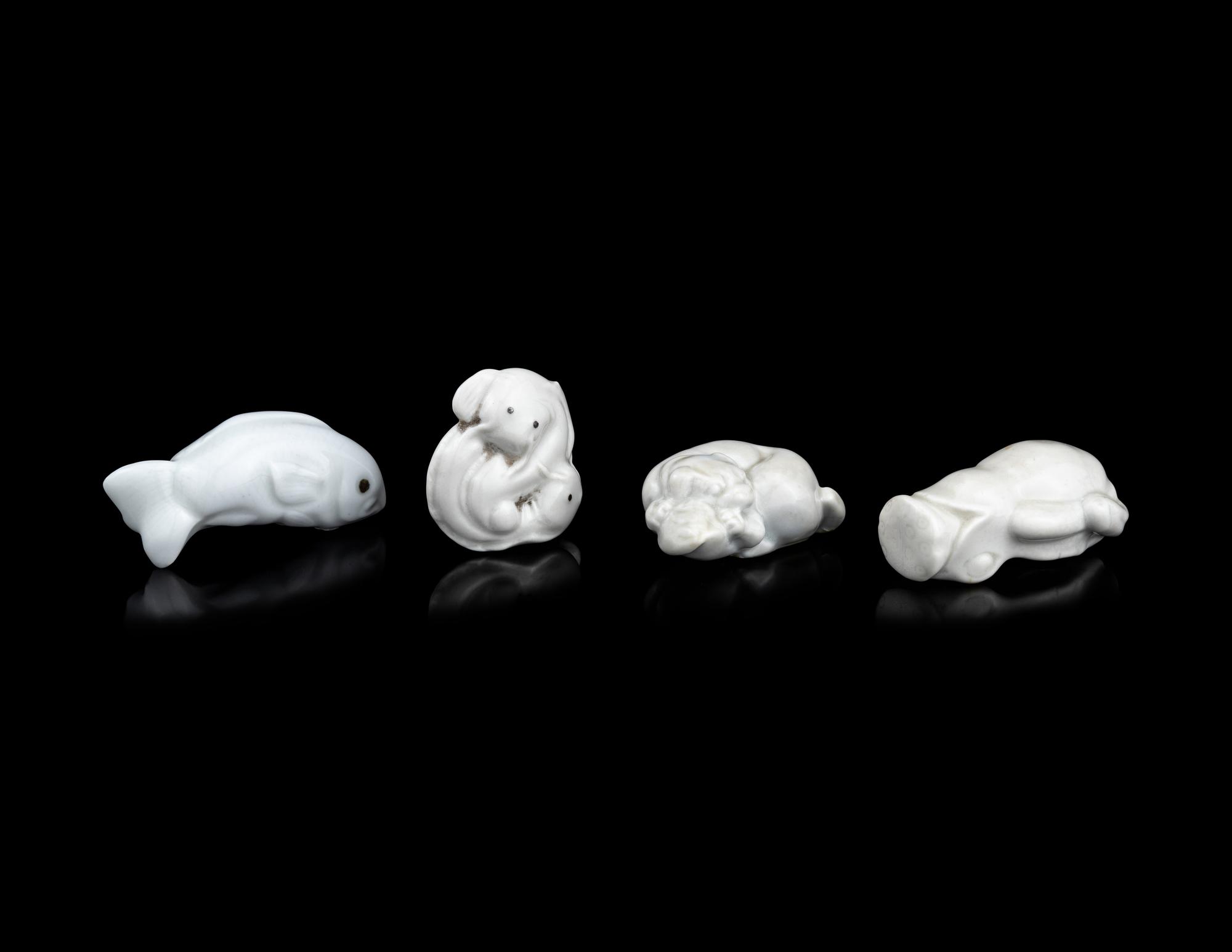 Four Japanese White Glazed Porcelain Animal-Form Netsuke