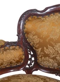 A Set of Four Rococo Style Upholstered Mahogany Armchairs