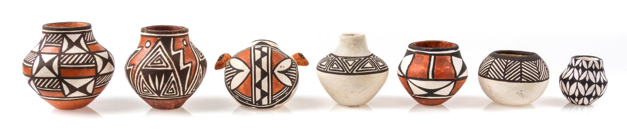 A Group of Thirteen Acoma Pueblo Pottery Articles Height of tallest 1 5/8 inches. — Various Makers