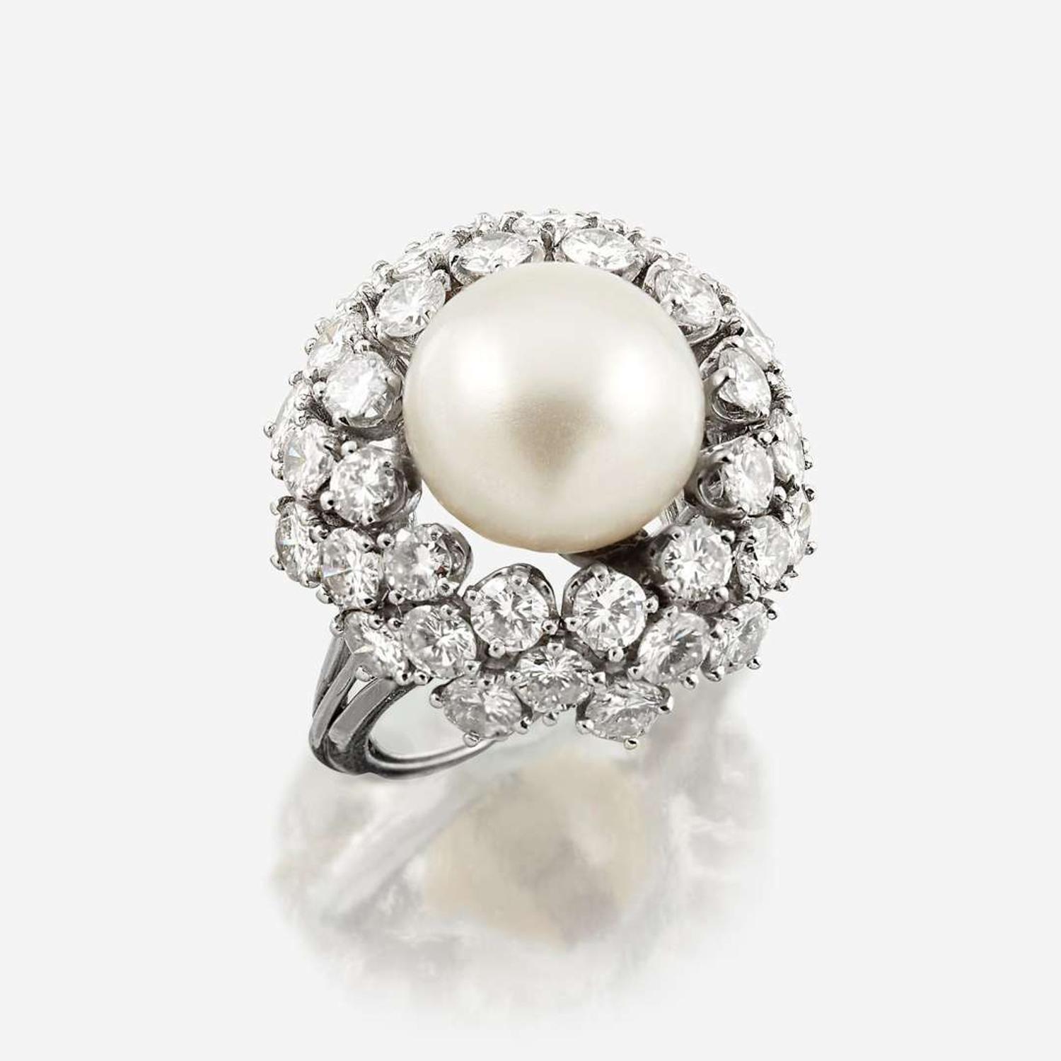 A cultured pearl, diamond, and eighteen karat white gold ring