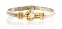 A 14 Karat Yellow Gold and Sterling Silver Bangle Bracelet, 19.90 dwts.