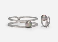 An 18K White Gold, Diamond, and Pearl Bracelet and Ring