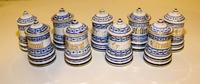 A Set of Nine Blue Onion Porcelain Canisters Height of each 4 inches. — EARLY 20TH CENTURY