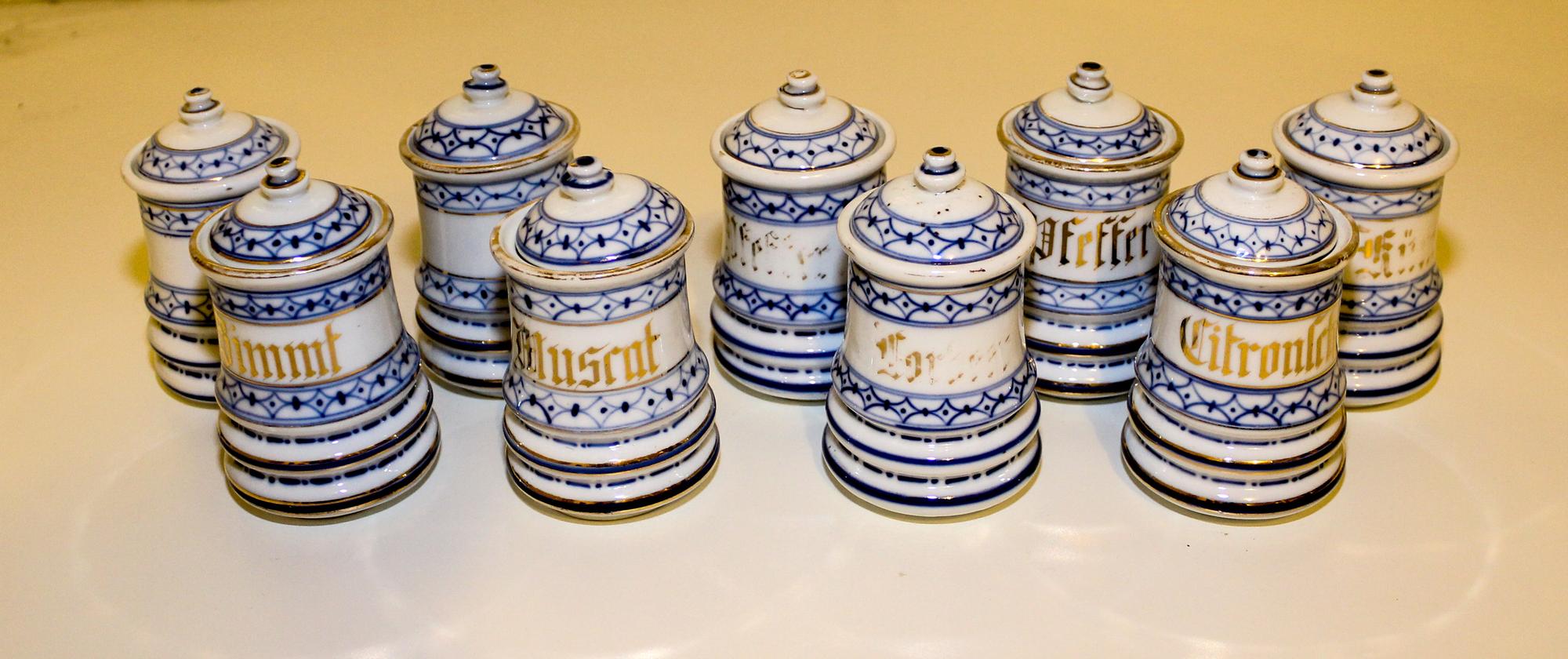 A Set of Nine Blue Onion Porcelain Canisters Height of each 4 inches. — EARLY 20TH CENTURY